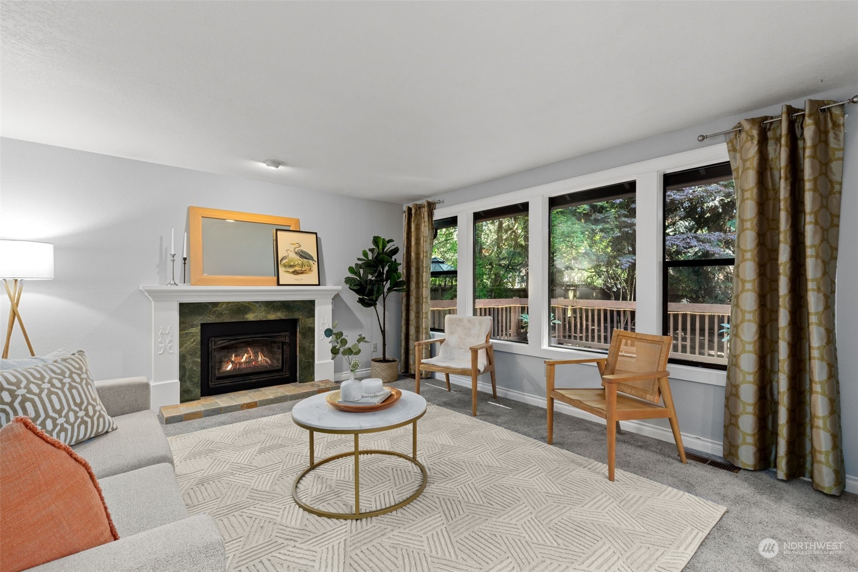 2330 243rd Place Southeast Bothell, WA 98021 - Photo 16 of 40 a living room with furniture and a fireplace