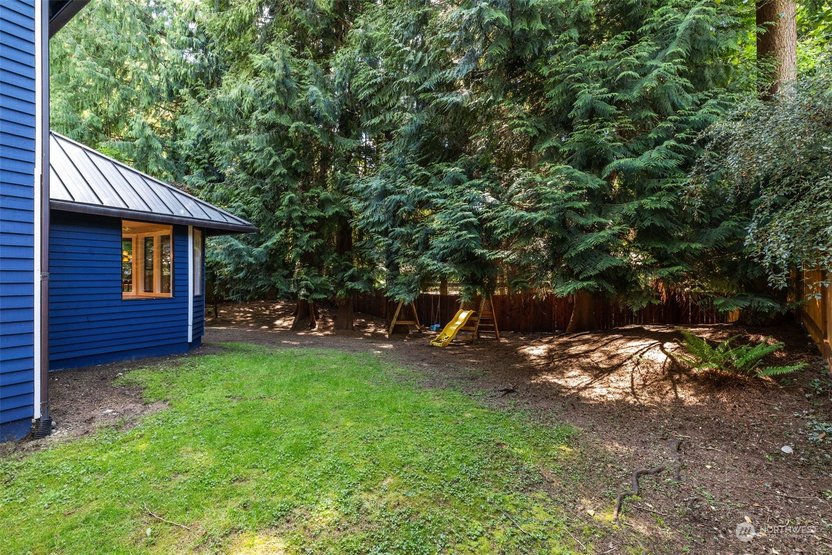2330 243rd Place Southeast Bothell, WA 98021 - Photo 37 of 40 a view of a backyard with plants and a garden
