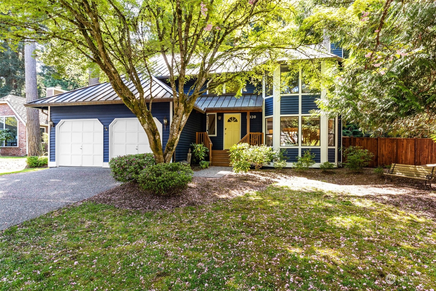 2330 243rd Place Southeast Bothell, WA 98021 - Photo 39 of 40 a front view of a house with garden