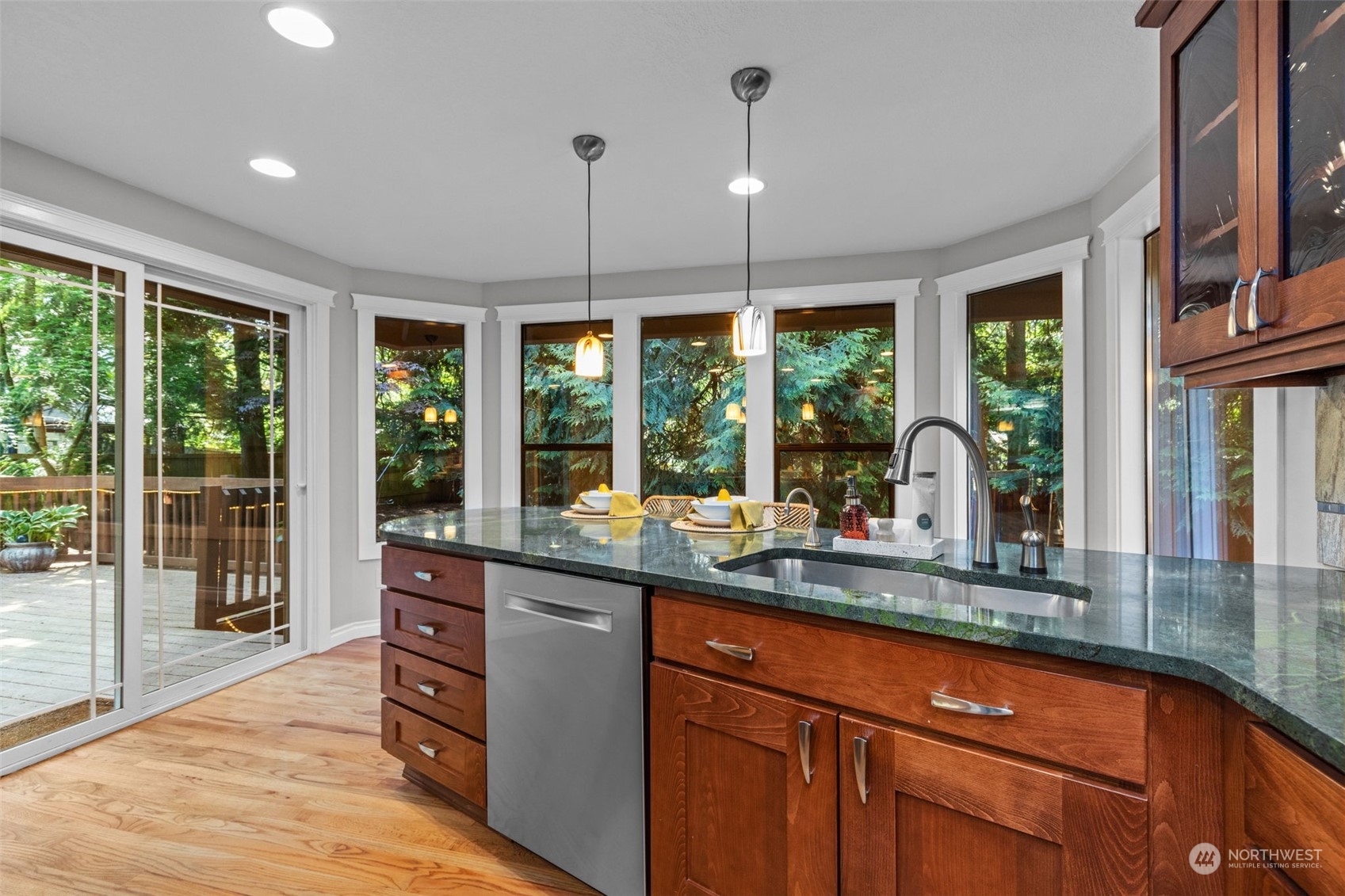 2330 243rd Place Southeast Bothell, WA 98021 - Photo 9 of 40 a kitchen with granite countertop a sink and a large window
