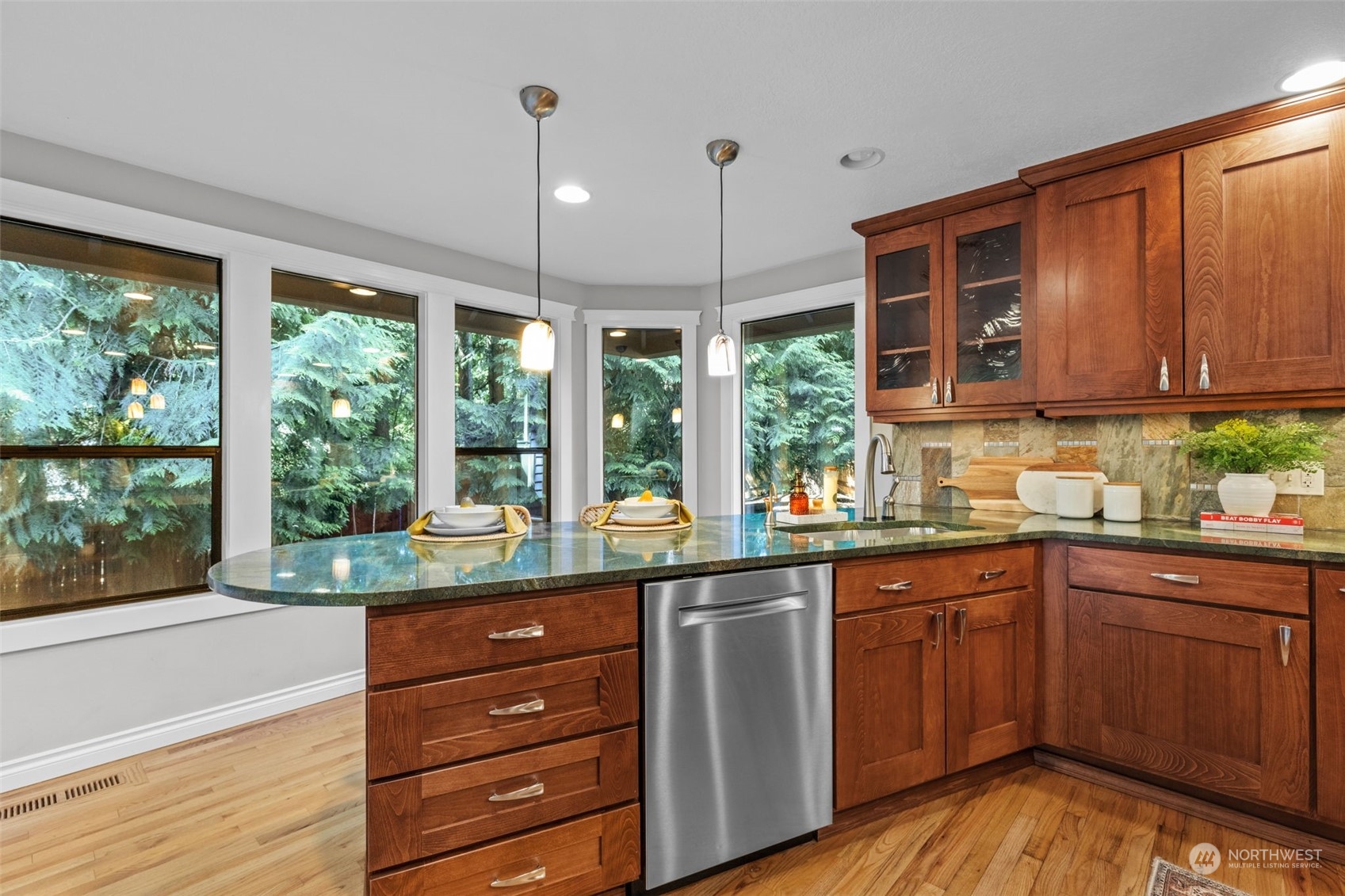 2330 243rd Place Southeast Bothell, WA 98021 - Photo 10 of 40 a kitchen with a sink window and cabinets