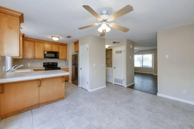 a view of a kitchen with a sink and cabinet area