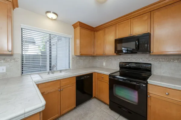 a kitchen with a sink and a window