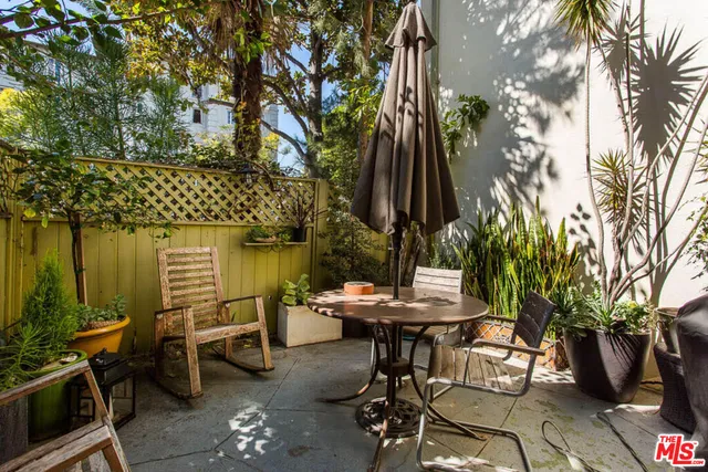 a view of a chairs and table in a patio