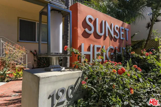 a view of outdoor space with signage and flags