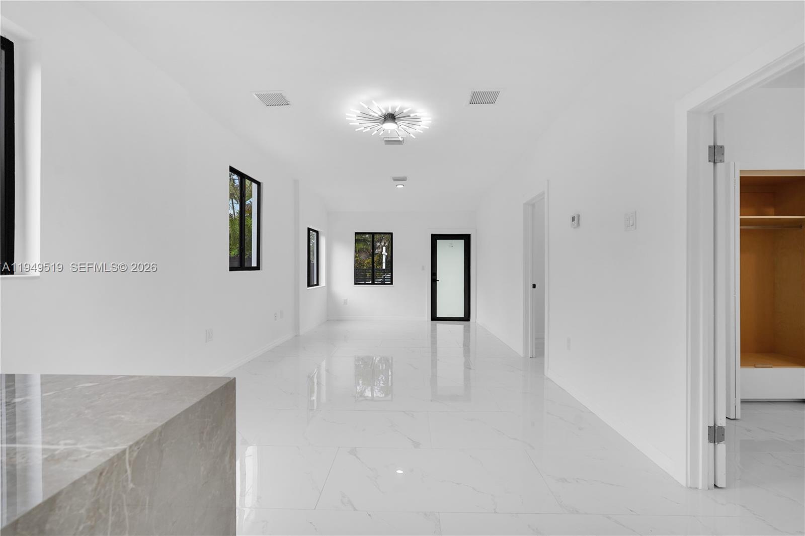 972 Southwest 44th Avenue Miami, FL 33134 - Photo 26 of 53 a view of a room with window and ceiling fan