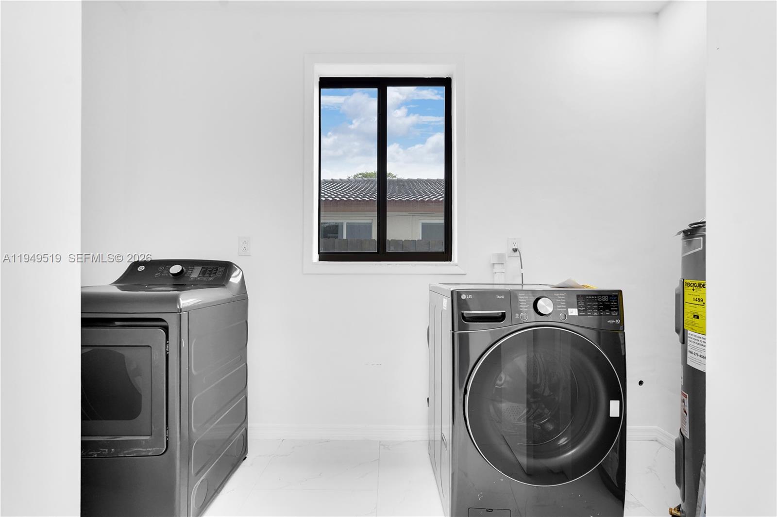 972 Southwest 44th Avenue Miami, FL 33134 - Photo 4 of 53 a utility room with dryer and washer