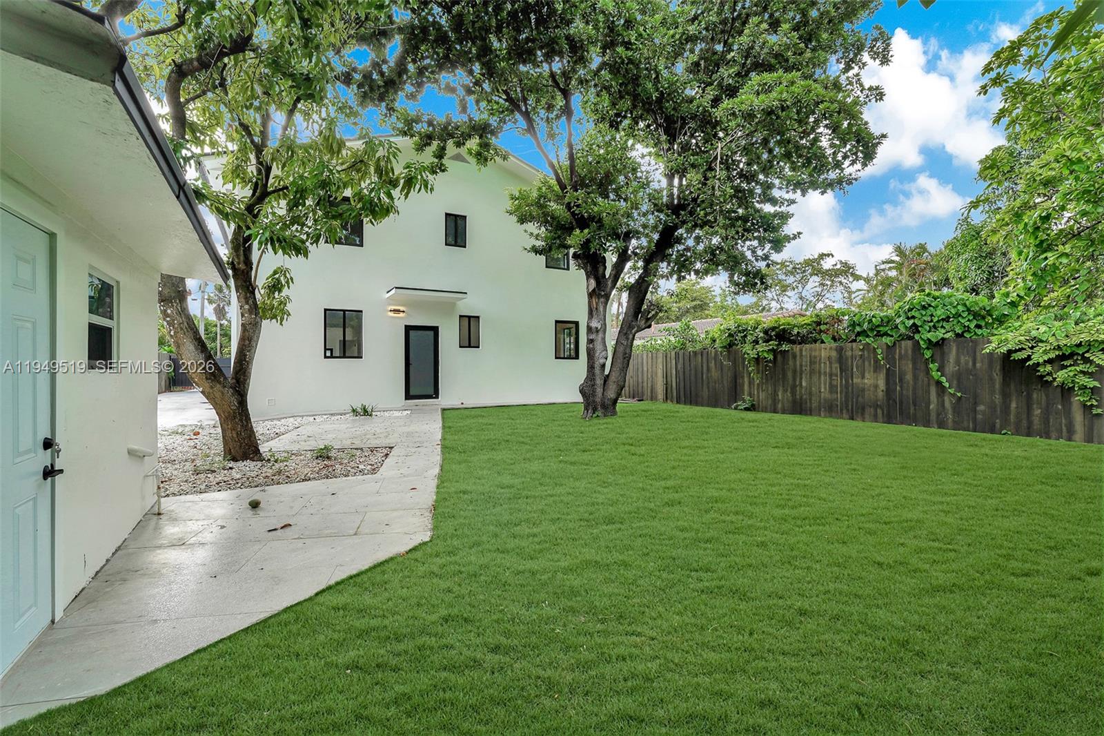 972 Southwest 44th Avenue Miami, FL 33134 - Photo 48 of 53 a front view of a house with a garden and yard