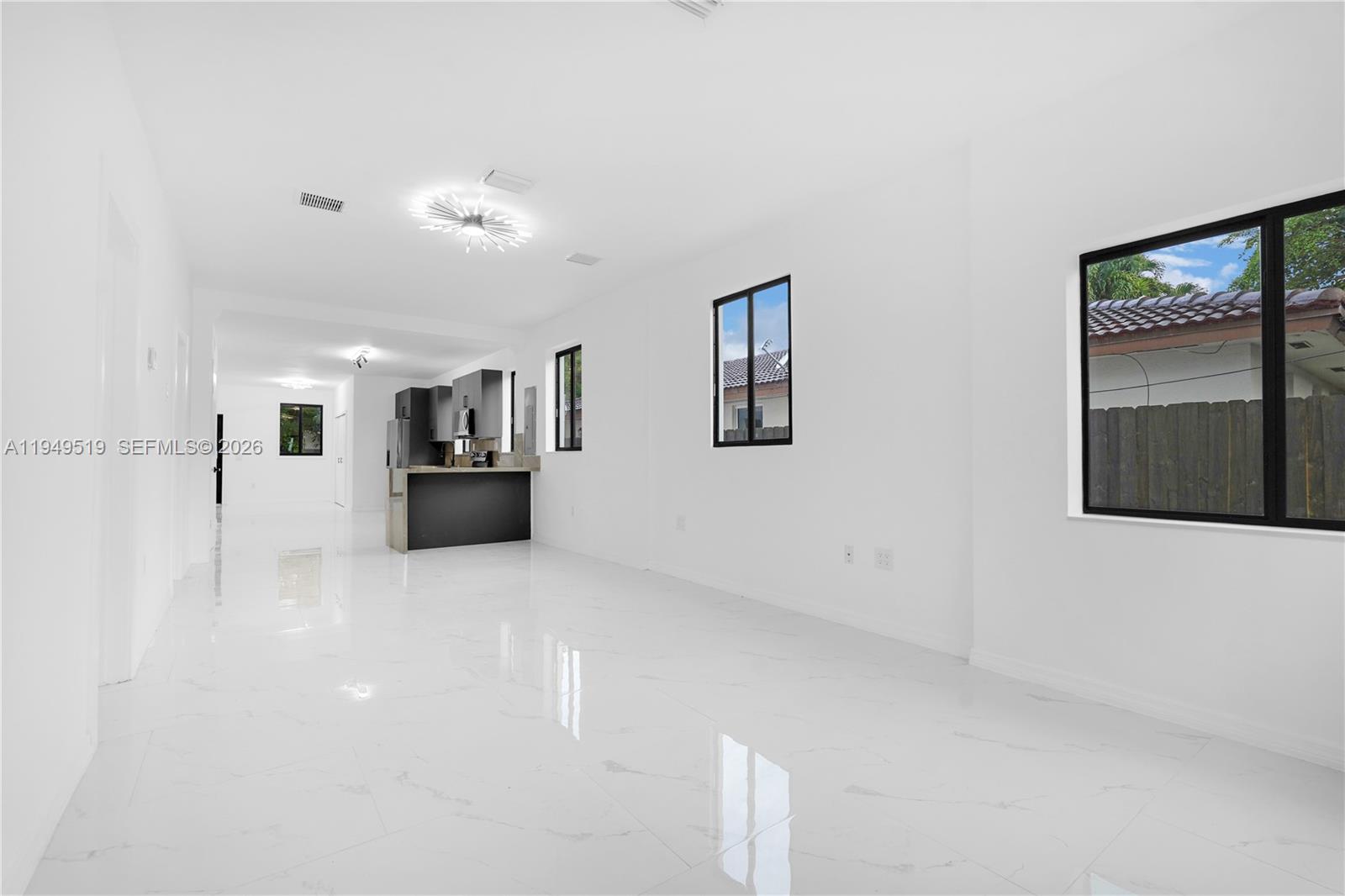 972 Southwest 44th Avenue Miami, FL 33134 - Photo 10 of 53 a view of a kitchen with furniture and an empty room