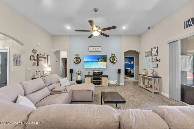 a view of a dining room with furniture and a window