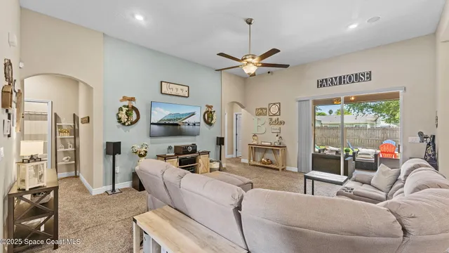 a room with a window and chandelier