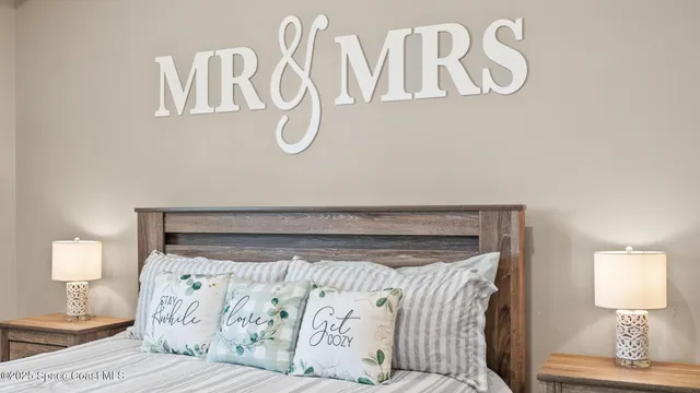 a bathroom with a granite countertop sink toilet a mirror and shower