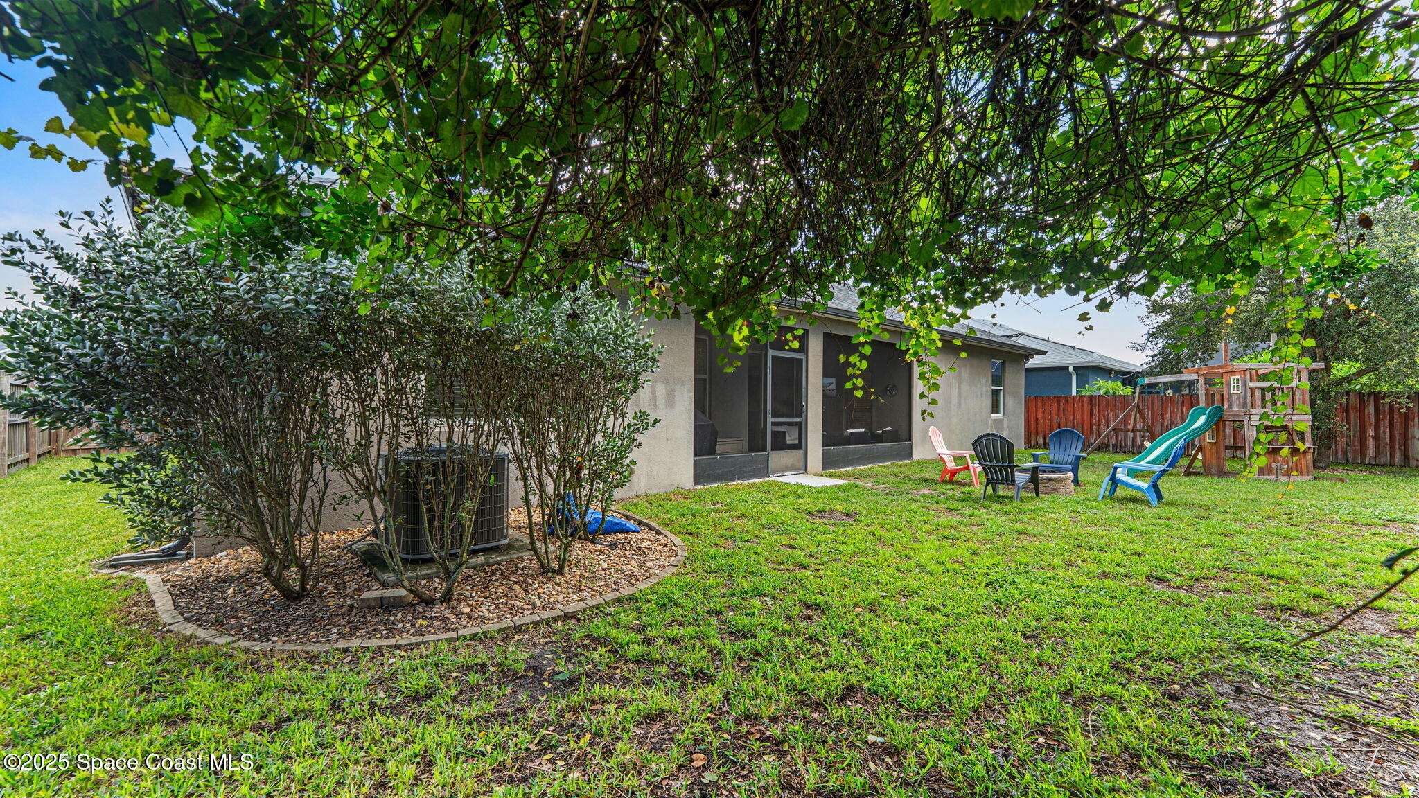 1106 Morgan Circle Northeast Palm Bay, FL 32905 - Photo 43 of 53 a view of a house with backyard