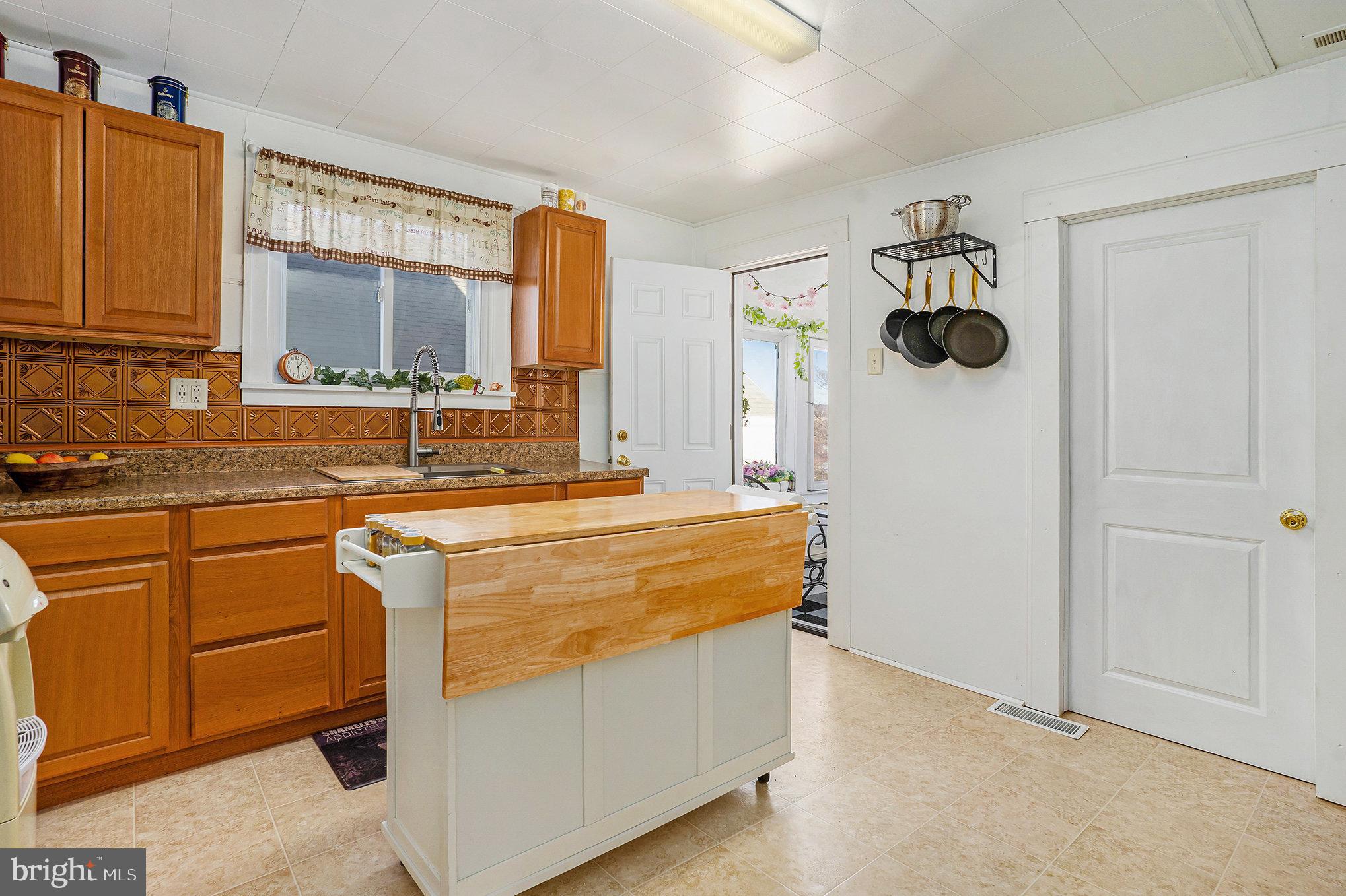 128 Pikeland Avenue Spring City, PA 19475 - Photo 13 of 30 a view of a kitchen with a sink and cabinets