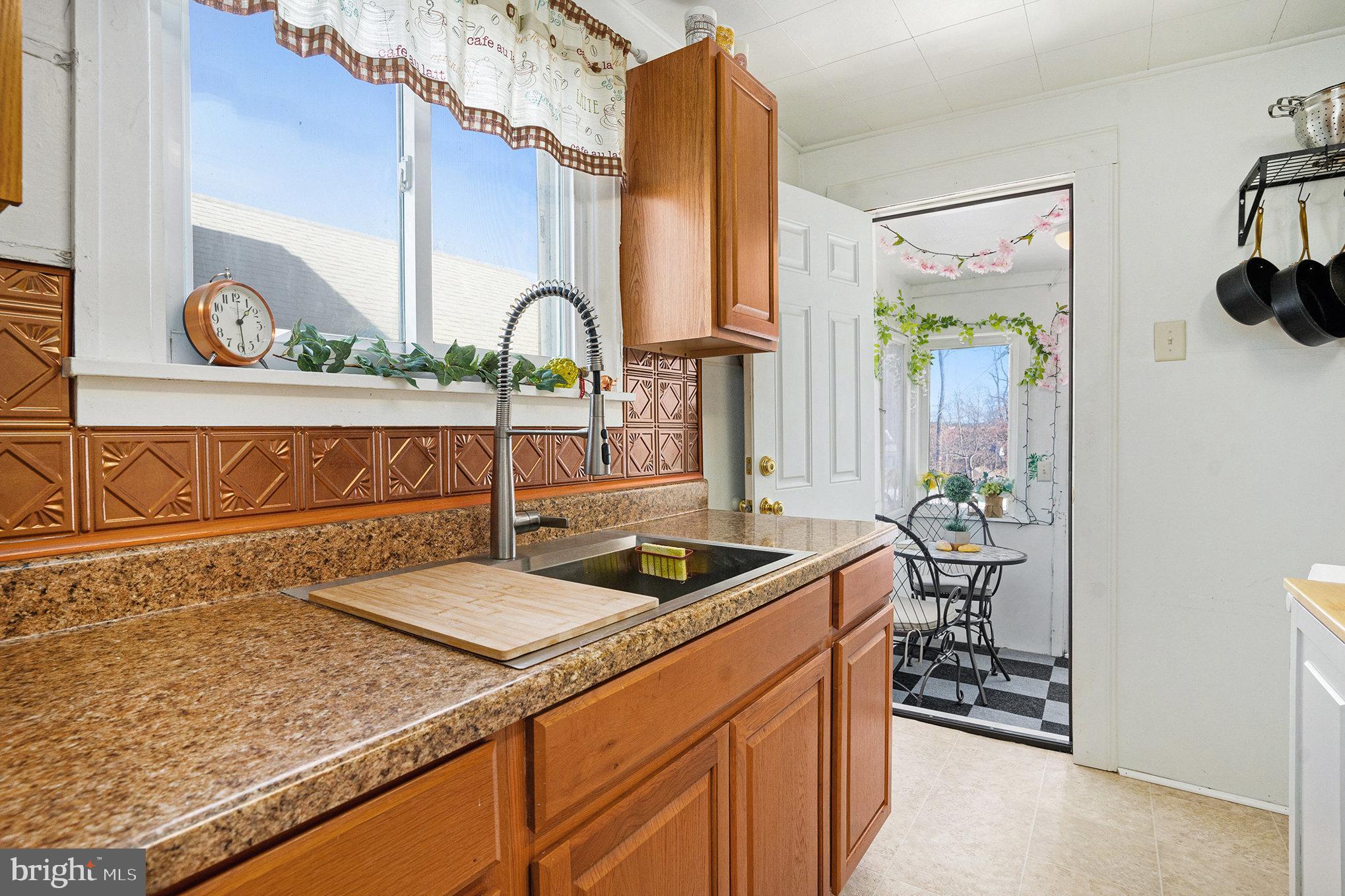 128 Pikeland Avenue Spring City, PA 19475 - Photo 14 of 30 a kitchen with a sink and a stove top oven
