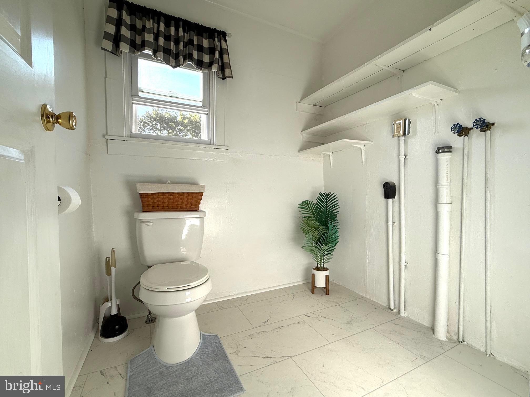 128 Pikeland Avenue Spring City, PA 19475 - Photo 15 of 30 a bathroom with a toilet sink and shower