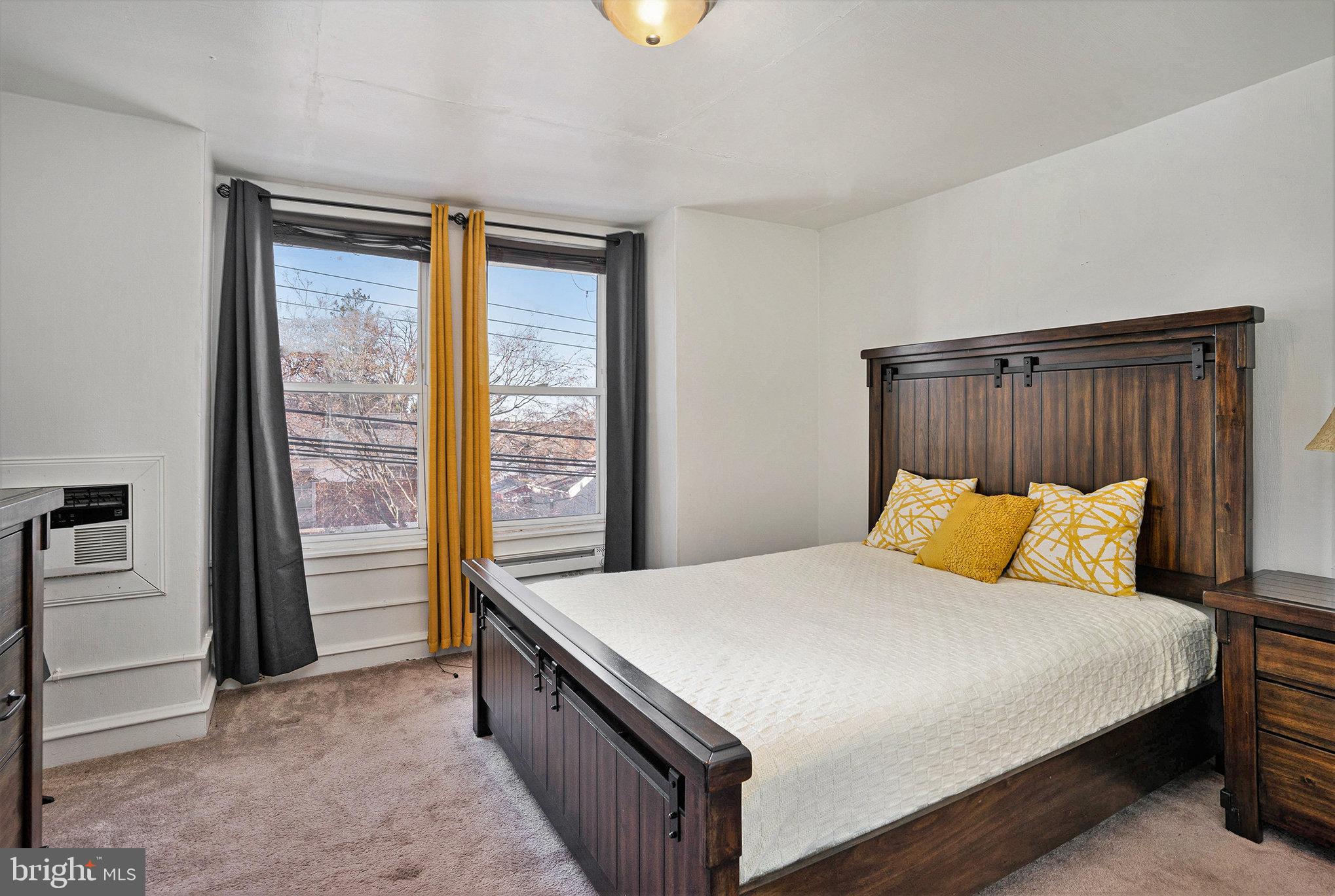 128 Pikeland Avenue Spring City, PA 19475 - Photo 23 of 30 a bedroom with a bed and a lamp next to a window