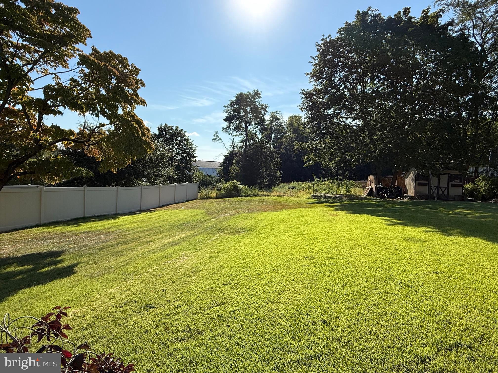 128 Pikeland Avenue Spring City, PA 19475 - Photo 5 of 30 a swimming pool that has lawn chairs and a yard