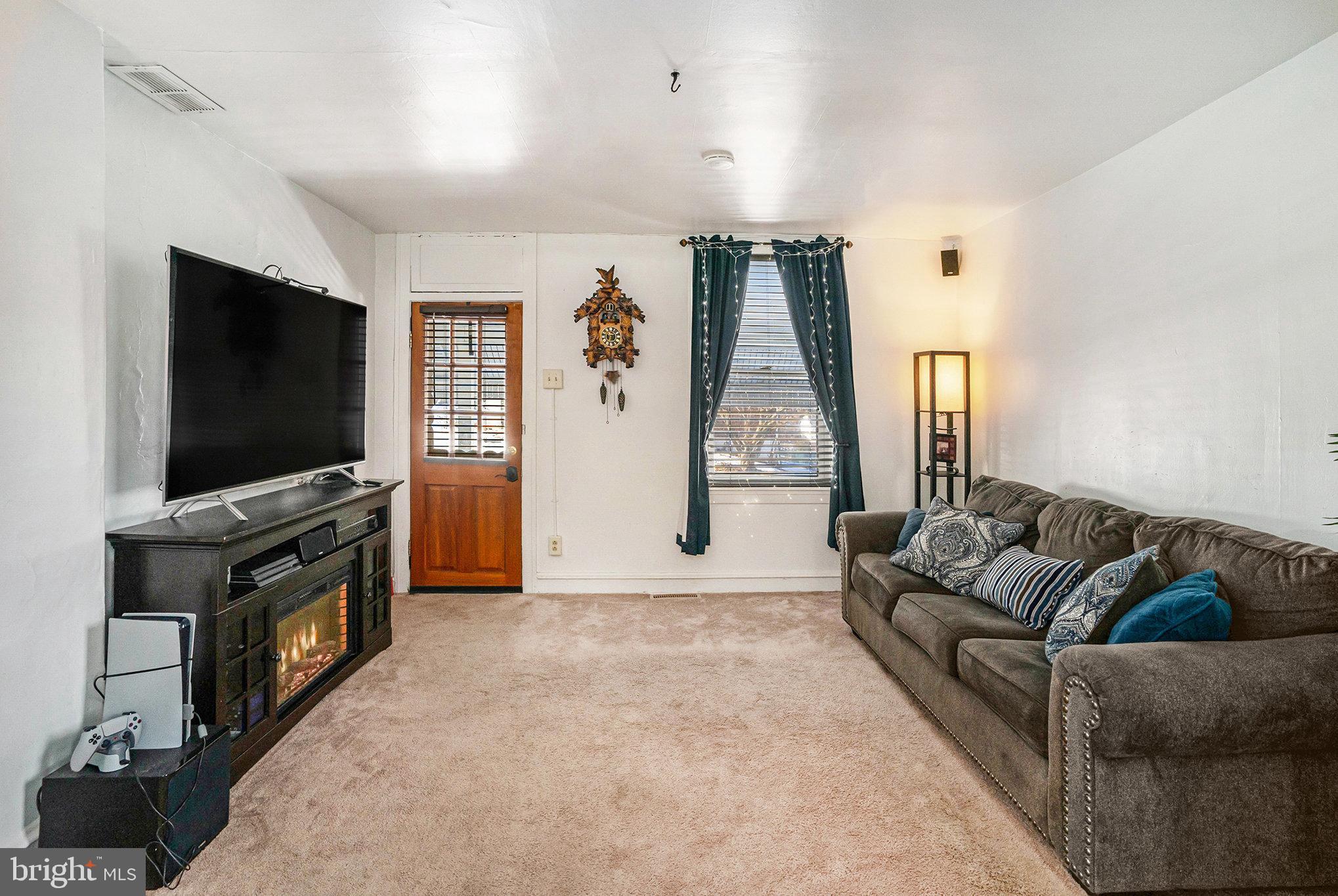 128 Pikeland Avenue Spring City, PA 19475 - Photo 6 of 30 a living room with furniture and a flat screen tv