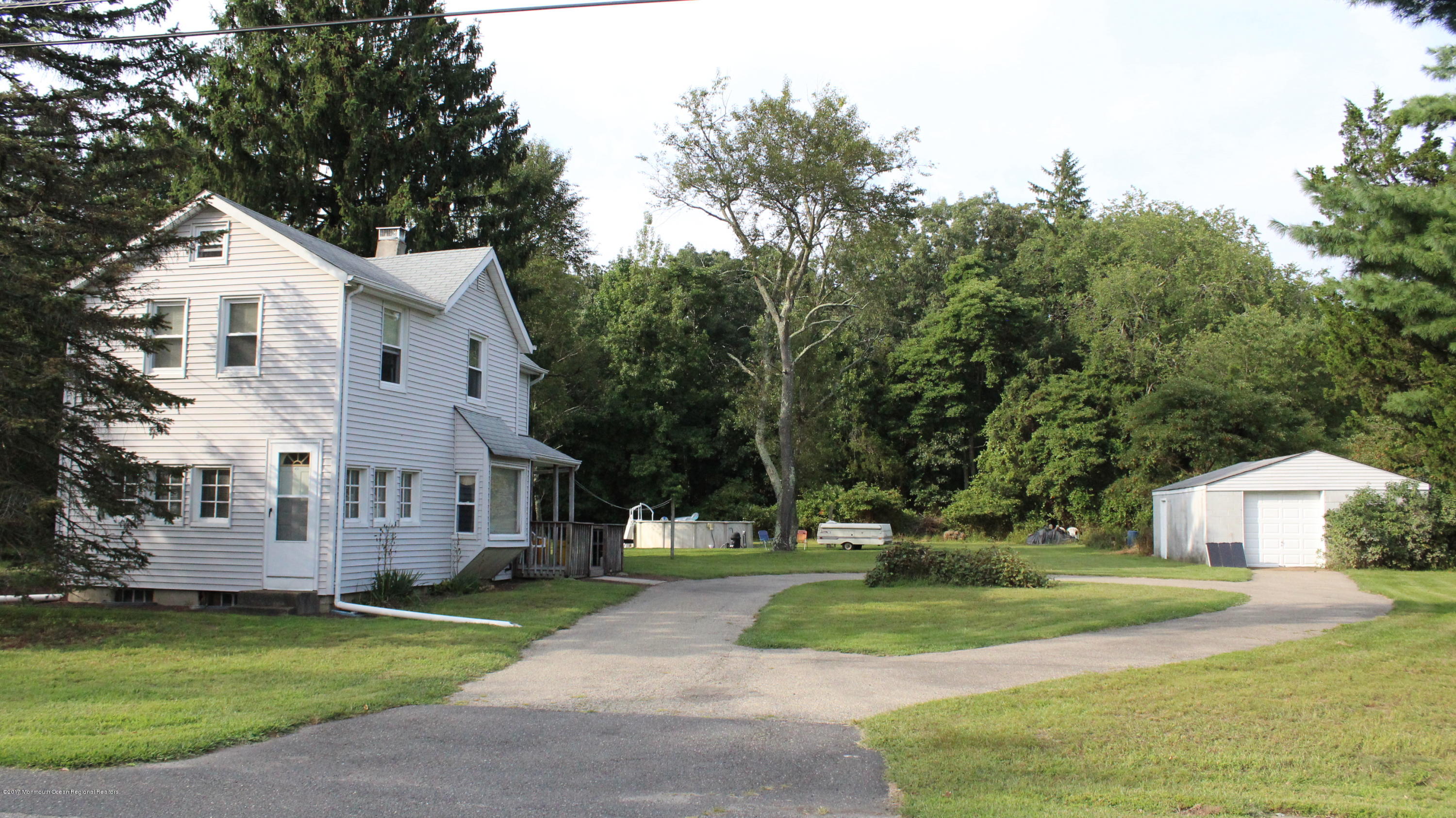 451 Pfister Road Jackson, NJ 08527 - Photo 1 of 25 a view of a white house with a yard and large trees