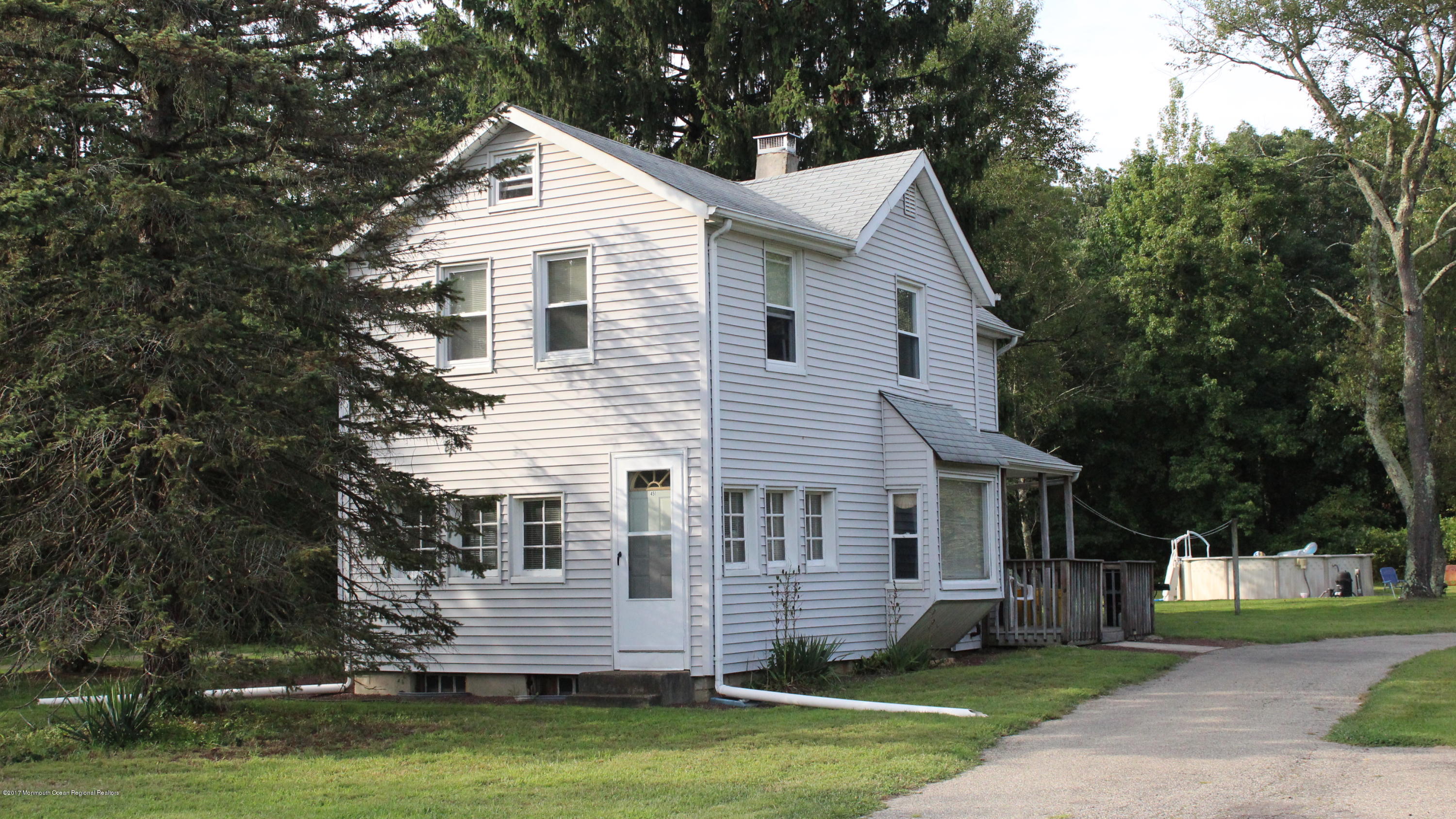 451 Pfister Road Jackson, NJ 08527 - Photo 2 of 25 a front view of a house with a yard and trees