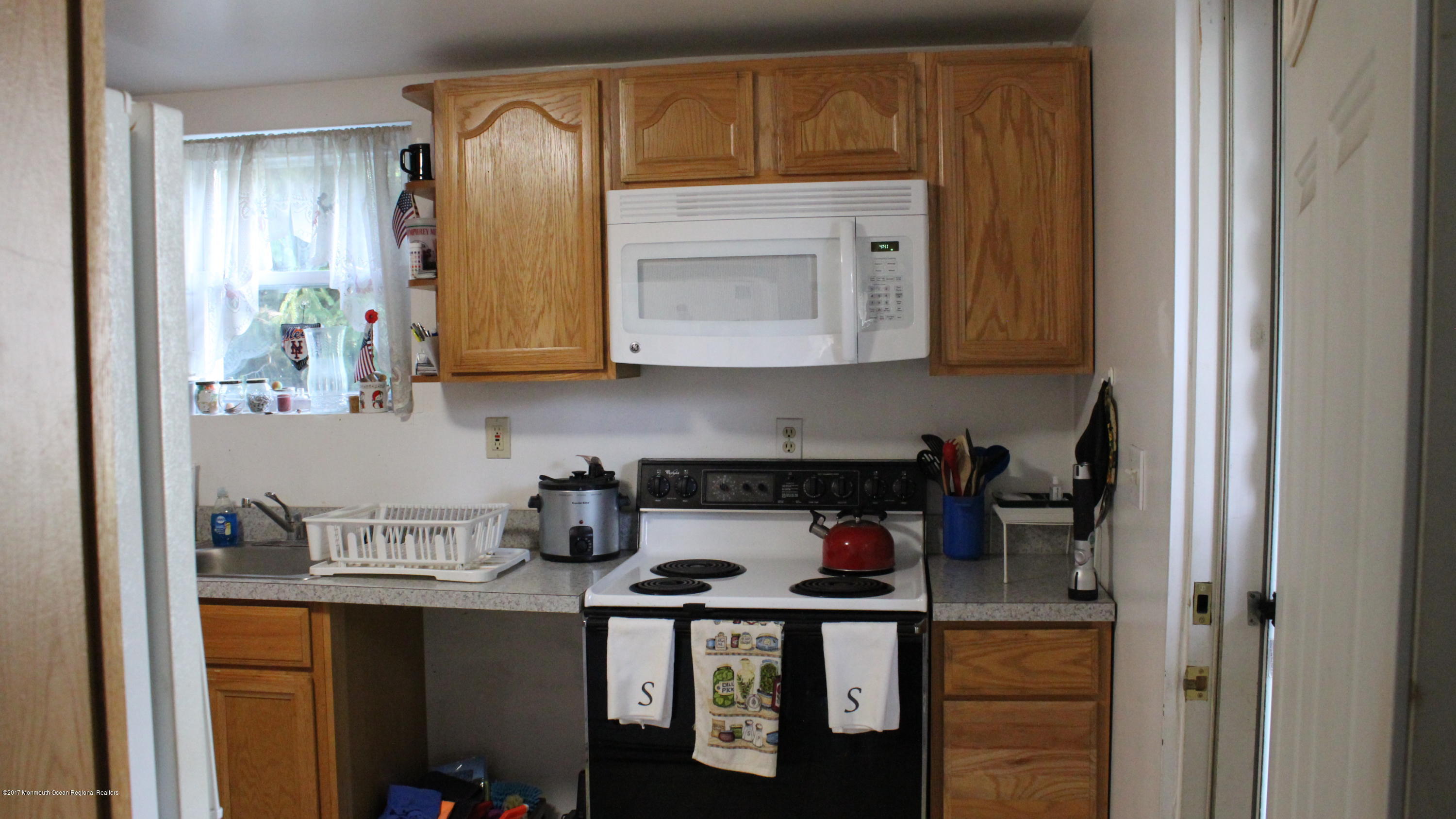 451 Pfister Road Jackson, NJ 08527 - Photo 14 of 25 a kitchen with a sink and cabinets