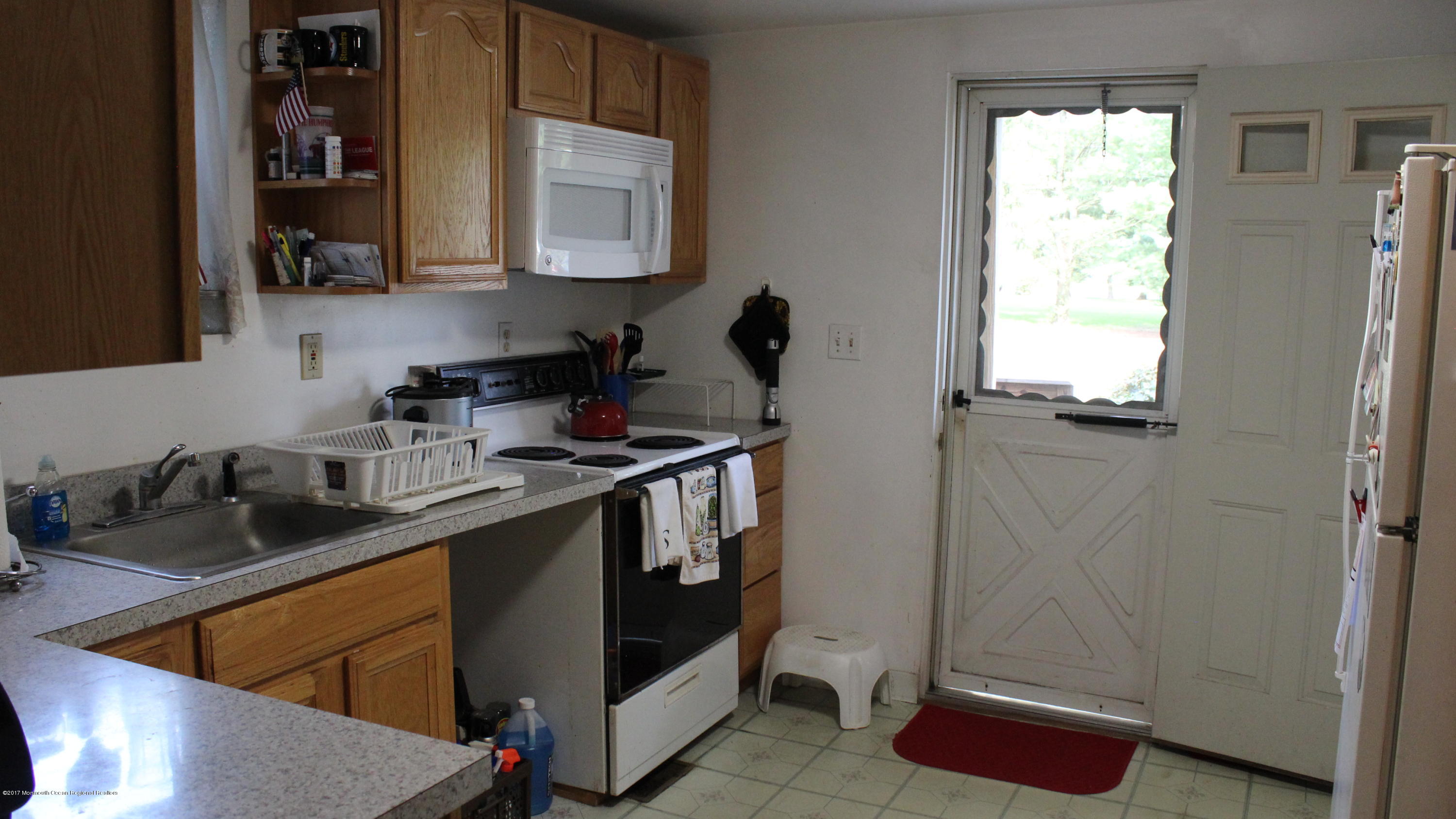 451 Pfister Road Jackson, NJ 08527 - Photo 16 of 25 a kitchen with stainless steel appliances granite countertop a sink stove and cabinets