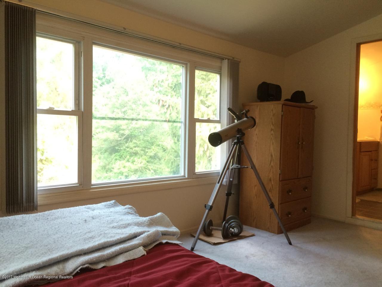 451 Pfister Road Jackson, NJ 08527 - Photo 7 of 25 a view of a room with gym equipment