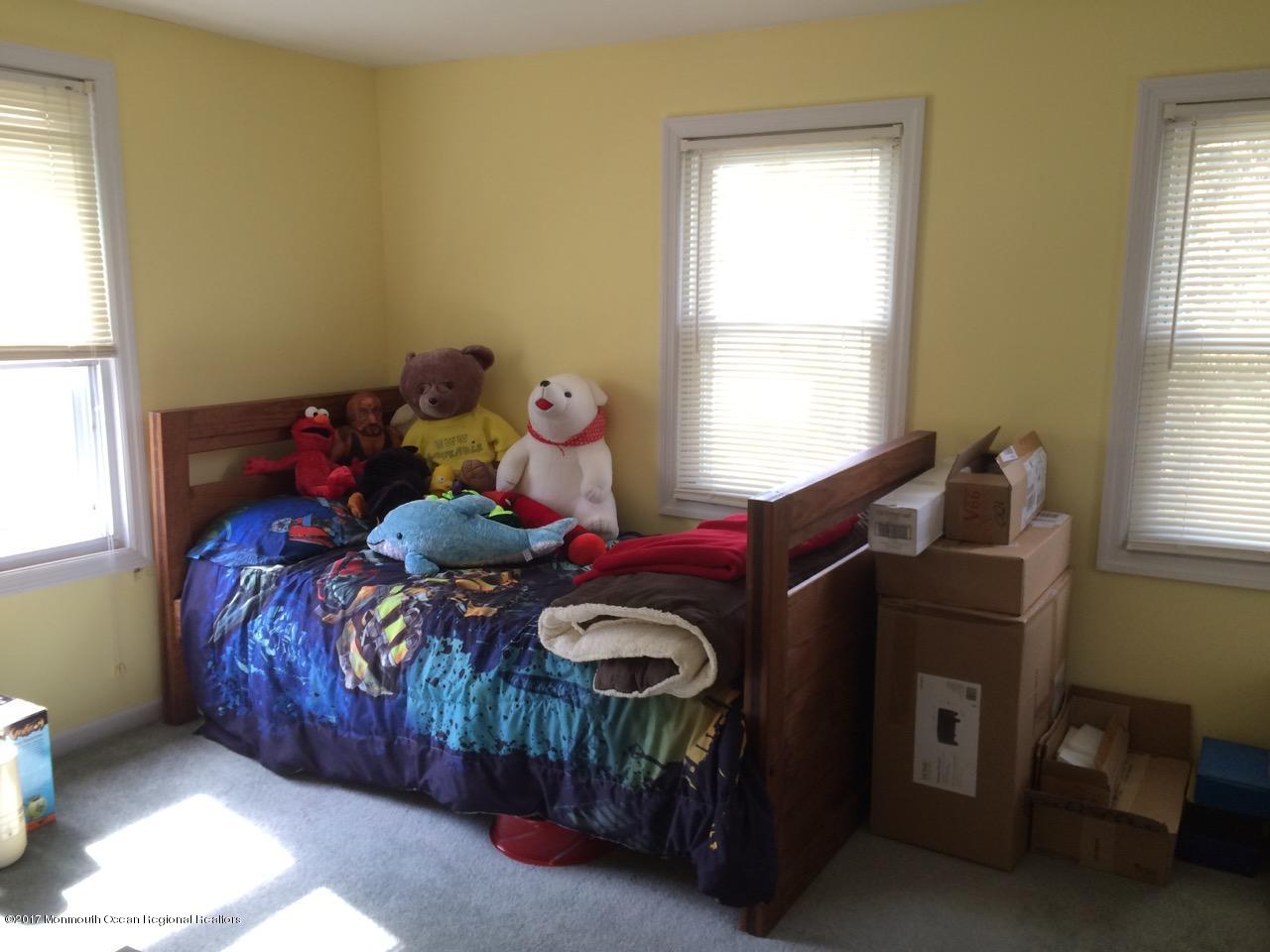 451 Pfister Road Jackson, NJ 08527 - Photo 9 of 25 a bedroom with a bed and a window