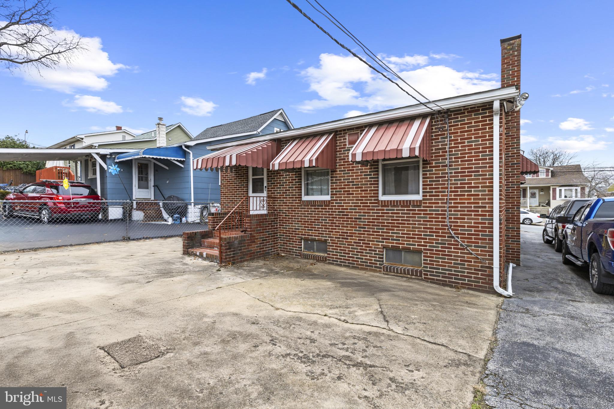 7627 Carson Avenue Baltimore, MD 21224 - Photo 29 of 38 a view of a car park in front of house