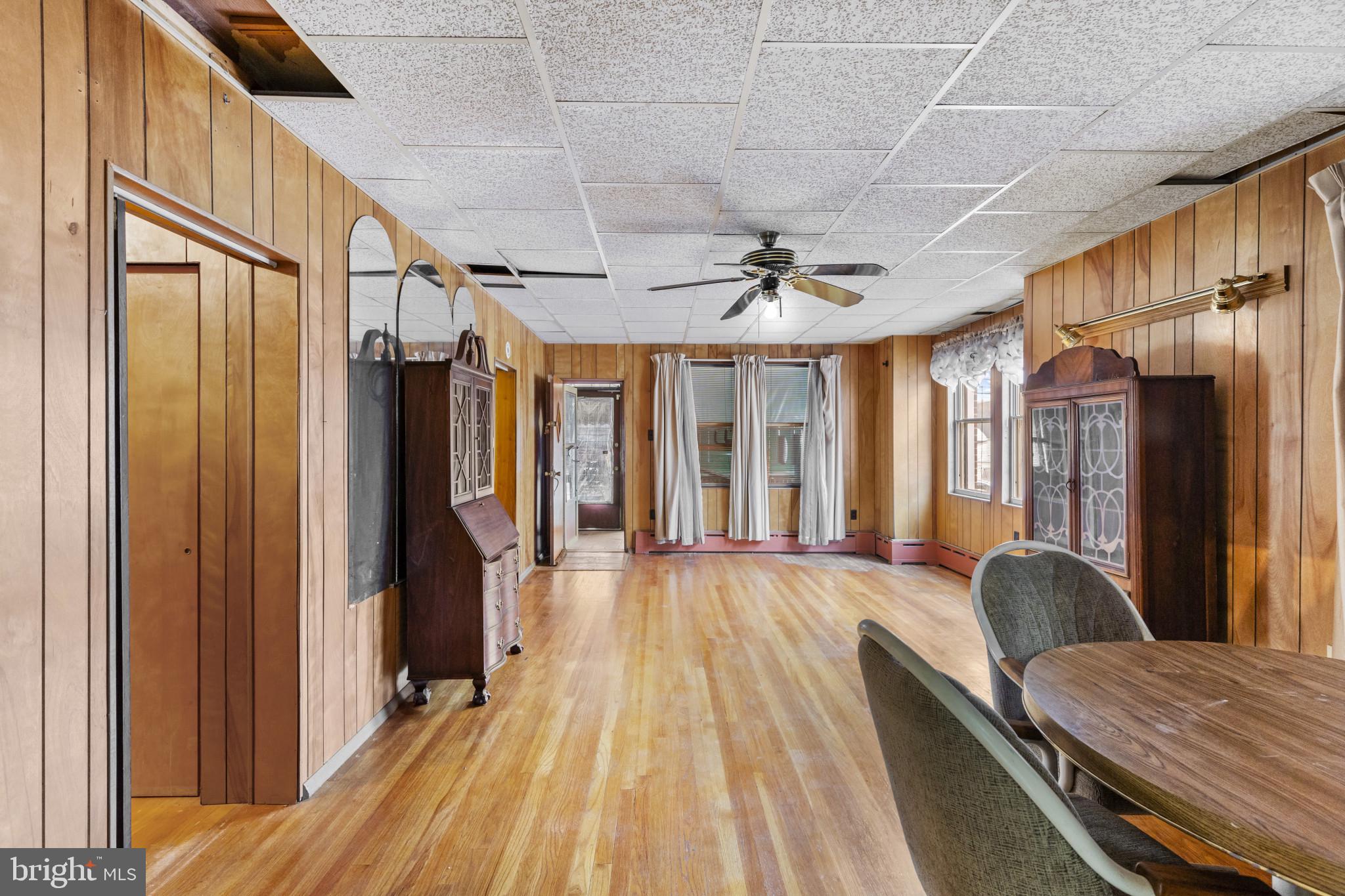 7627 Carson Avenue Baltimore, MD 21224 - Photo 3 of 38 a view of hallway with furniture and a chandelier