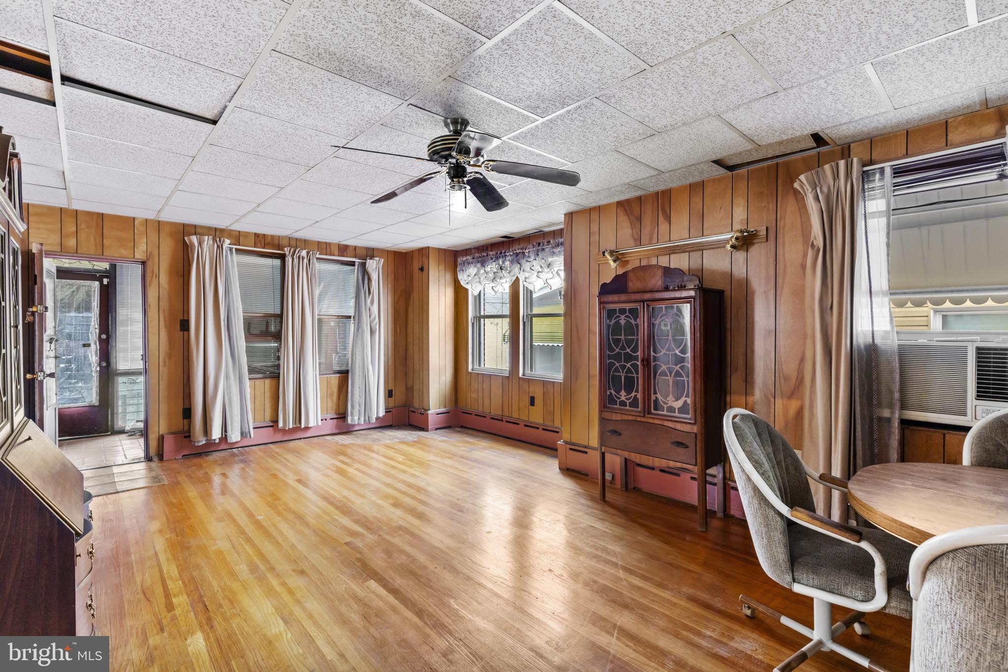 7627 Carson Avenue Baltimore, MD 21224 - Photo 9 of 38 a view of livingroom with furniture wooden floor and window