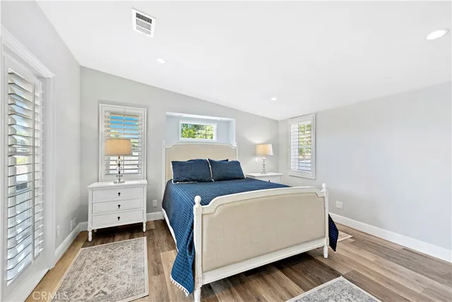 a bed room with a bed and a window