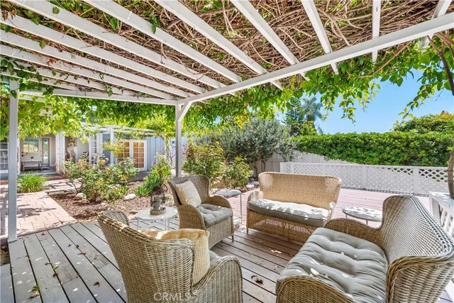 a view of a patio with couches chairs and potted plants