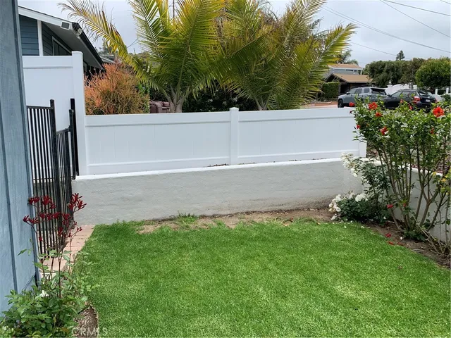 a view of backyard with a large garden and plants