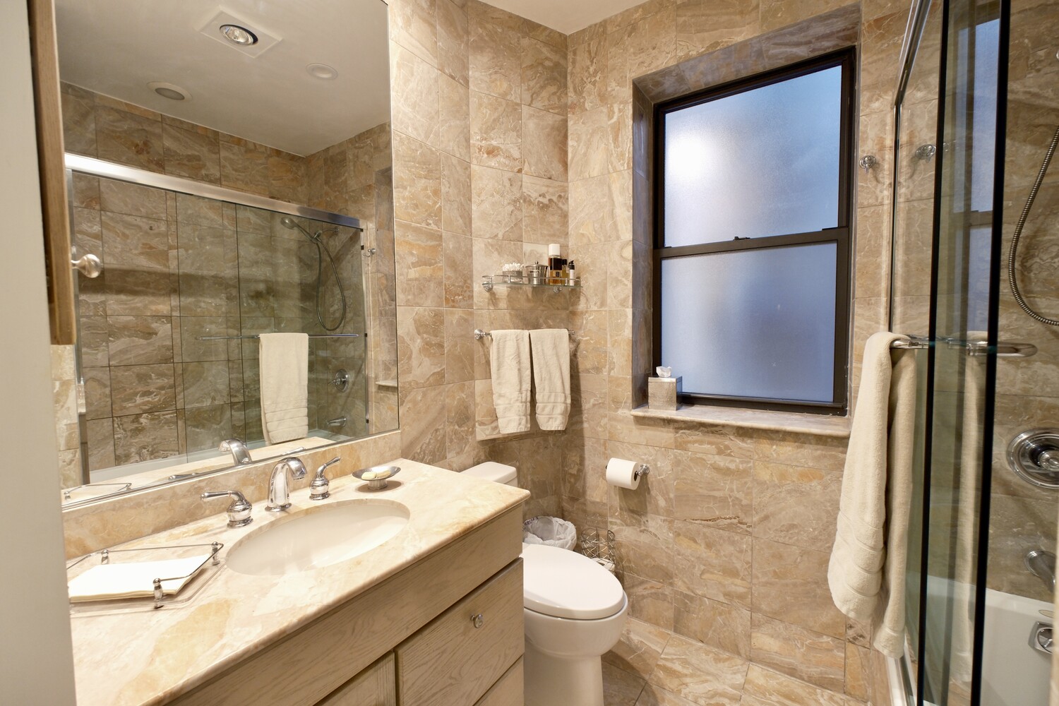 311 West 97th Street, Unit 2W Manhattan, NY 10025 - Photo 13 of 15 a bathroom with a sink and a mirror
