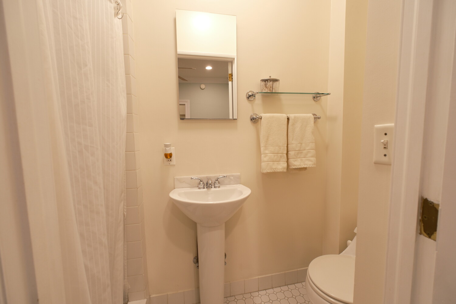 311 West 97th Street, Unit 2W Manhattan, NY 10025 - Photo 14 of 15 a bathroom with a sink toilet and shower