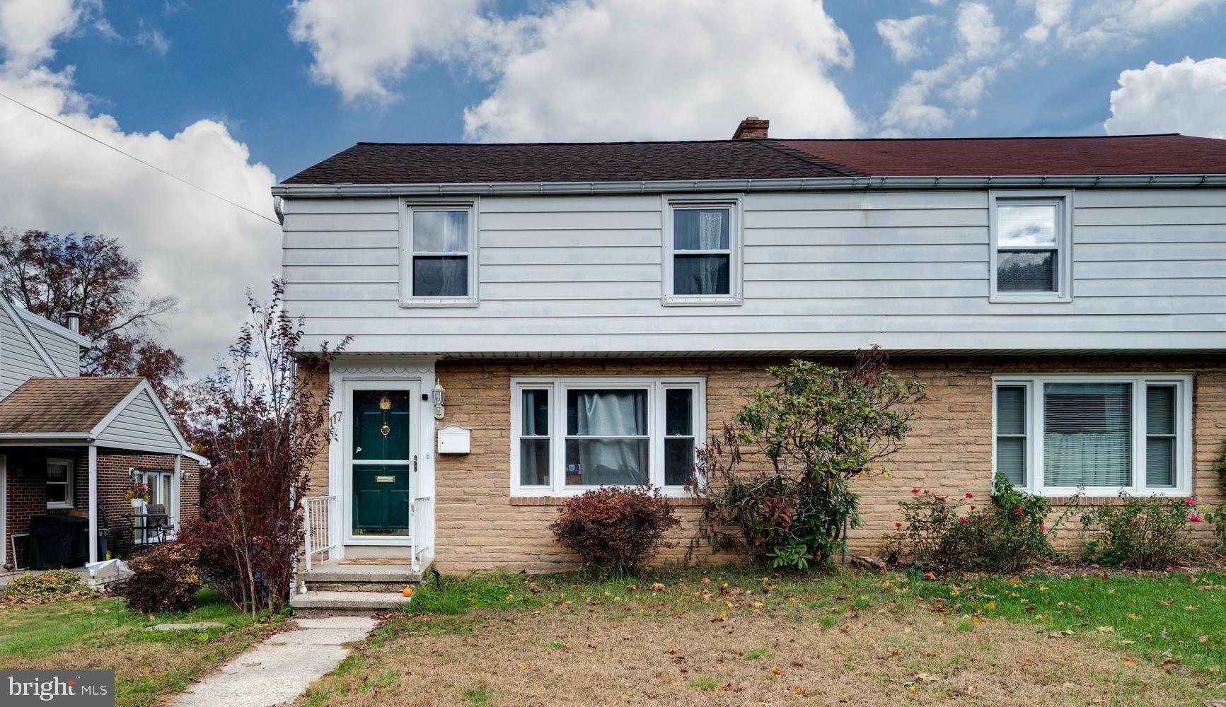117 East Broad Street Reading, PA 19607 - Photo 1 of 33 a front view of a house with garden and porch