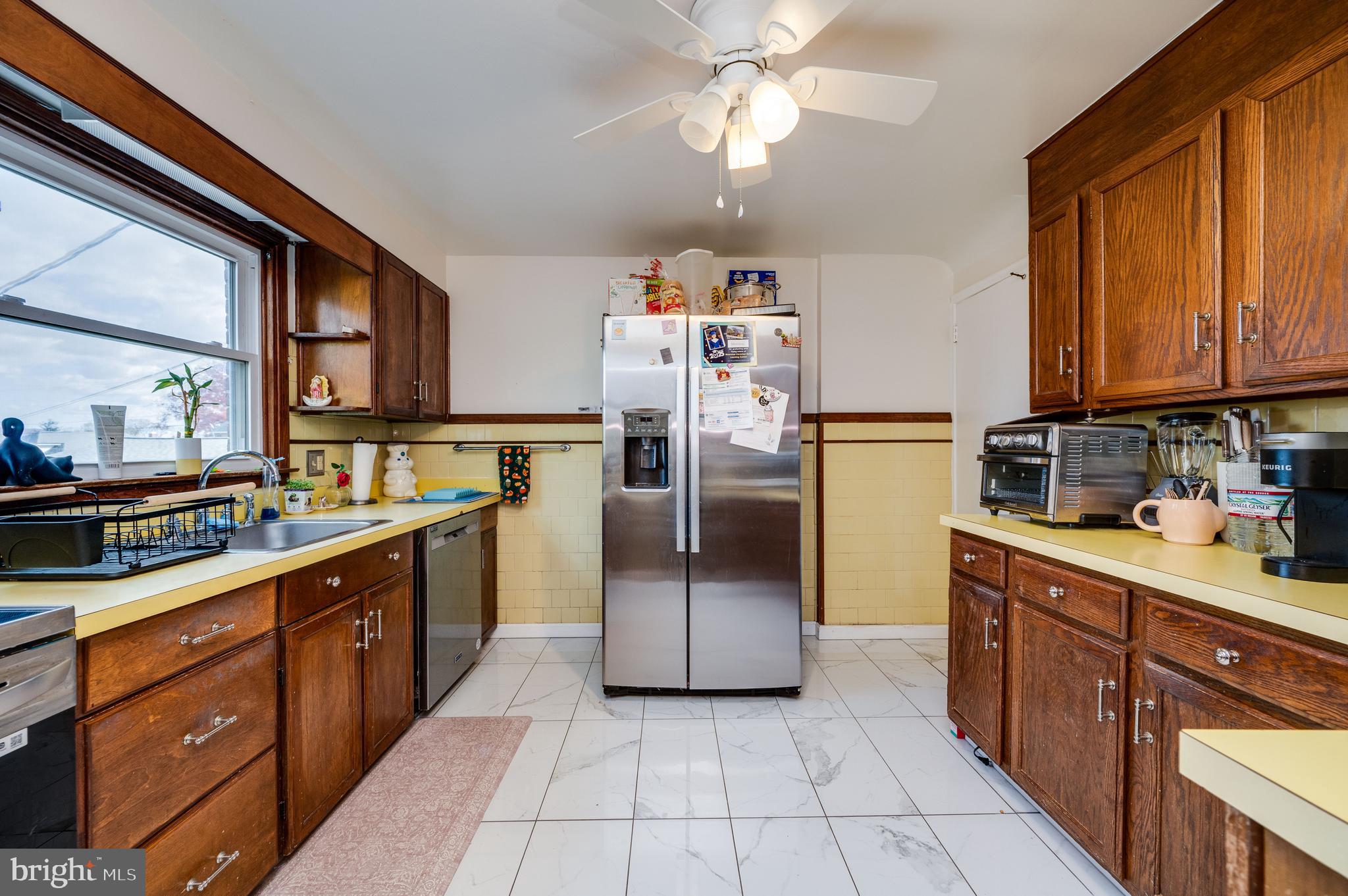 117 East Broad Street Reading, PA 19607 - Photo 15 of 33 a kitchen with stainless steel appliances granite countertop a refrigerator a sink dishwasher stove and oven
