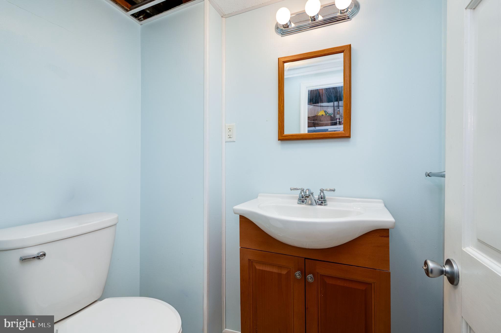 117 East Broad Street Reading, PA 19607 - Photo 25 of 33 a bathroom with a sink mirror and toilet