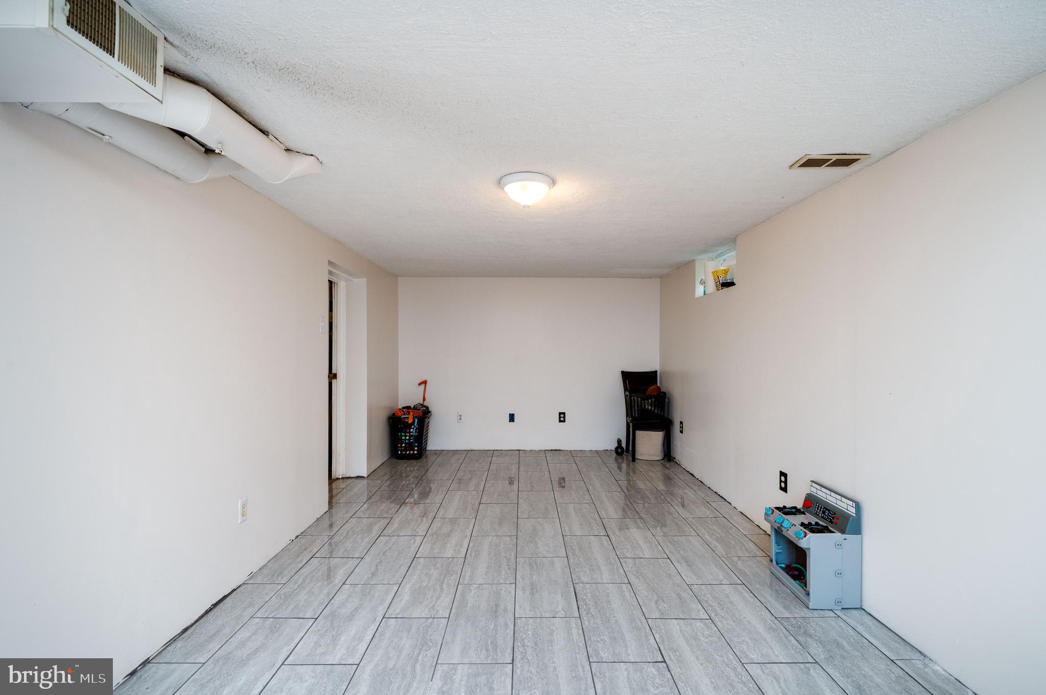 117 East Broad Street Reading, PA 19607 - Photo 28 of 33 a view of an empty room with wooden floor