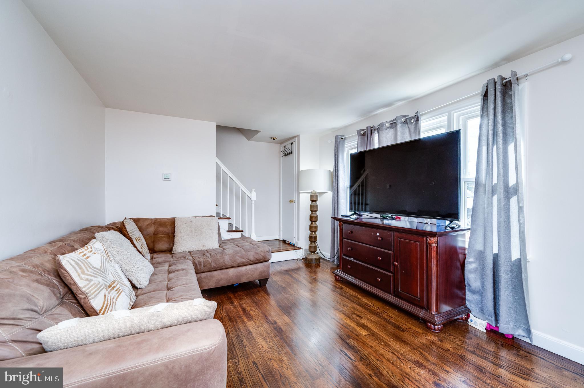 117 East Broad Street Reading, PA 19607 - Photo 7 of 33 a living room with furniture and a flat screen tv