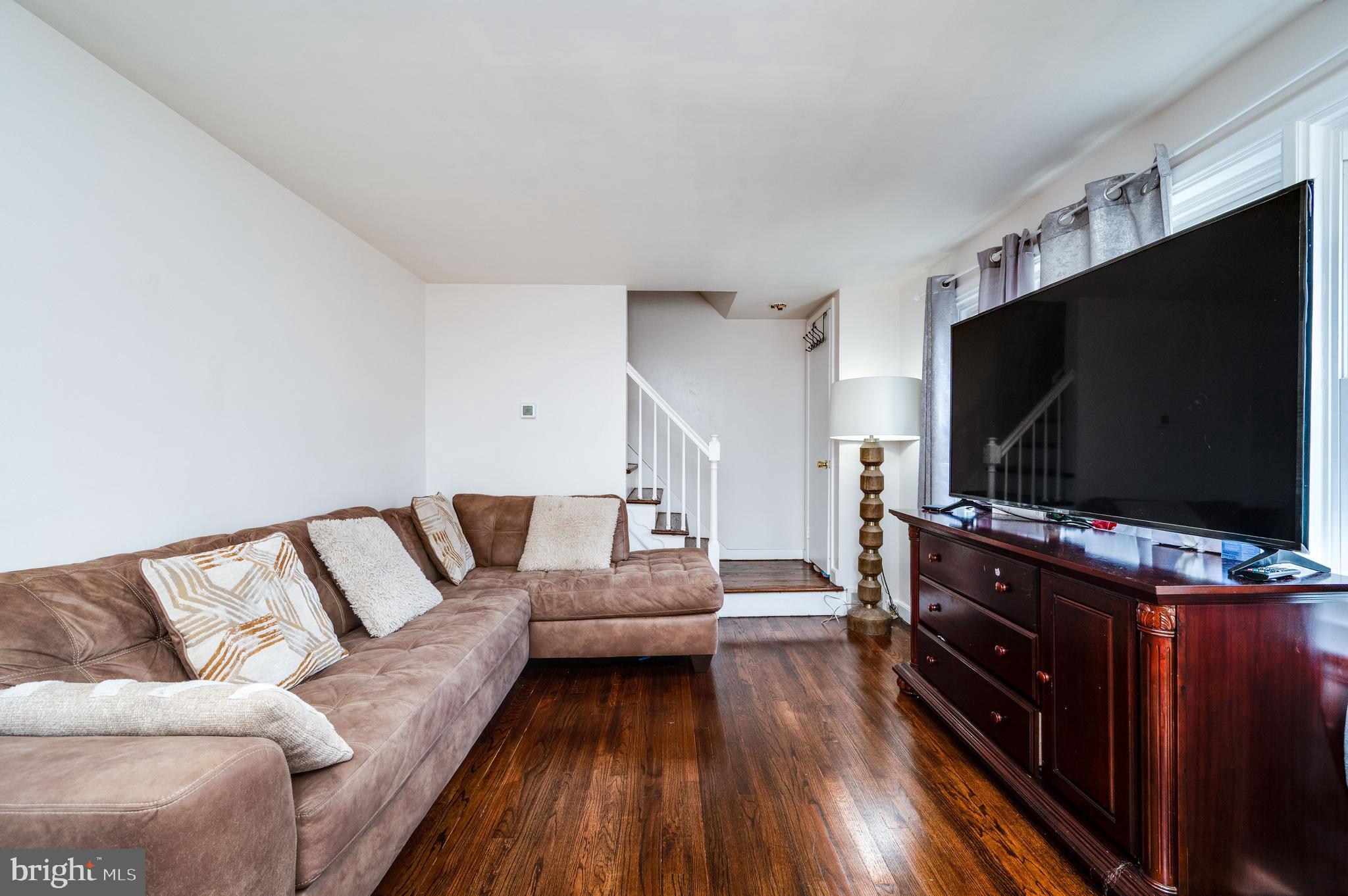 117 East Broad Street Reading, PA 19607 - Photo 8 of 33 a living room with furniture and a flat screen tv
