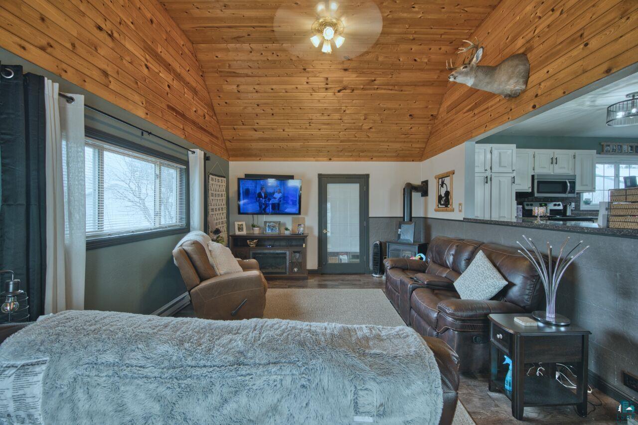 329 Wyandotte Road Hoyt Lakes, MN 55750 - Photo 11 of 52 Vaulted wood-paneled ceiling with a central fan light fixture