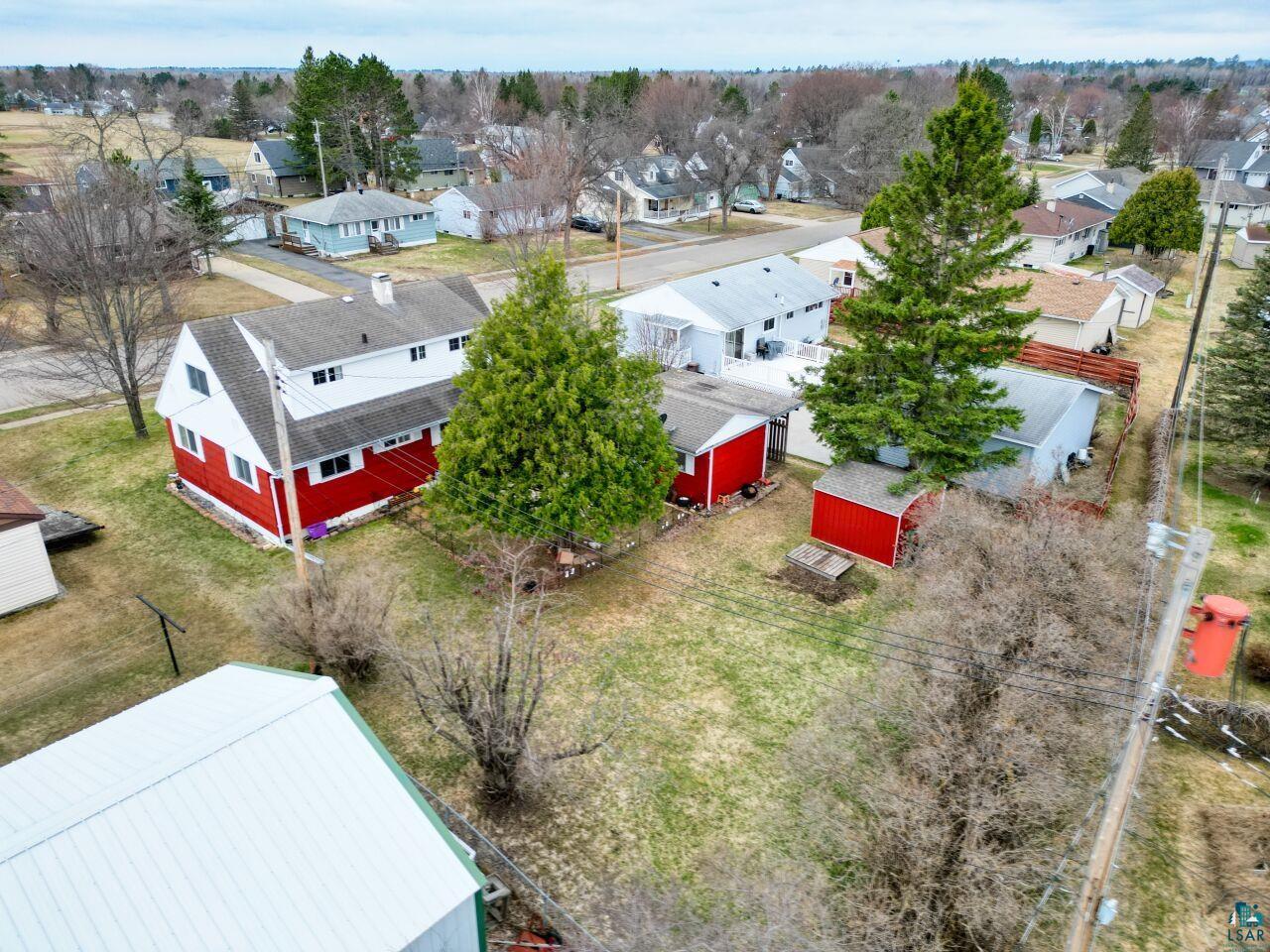 329 Wyandotte Road Hoyt Lakes, MN 55750 - Photo 51 of 52 Two-story residence with a red-painted lower exterior and white upper exterior