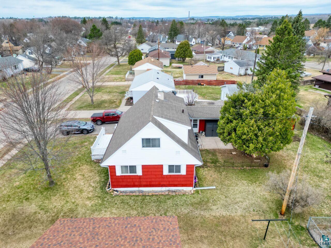 329 Wyandotte Road Hoyt Lakes, MN 55750 - Photo 52 of 52 Two-story residence with a red and white exterior and a gray shingle roof