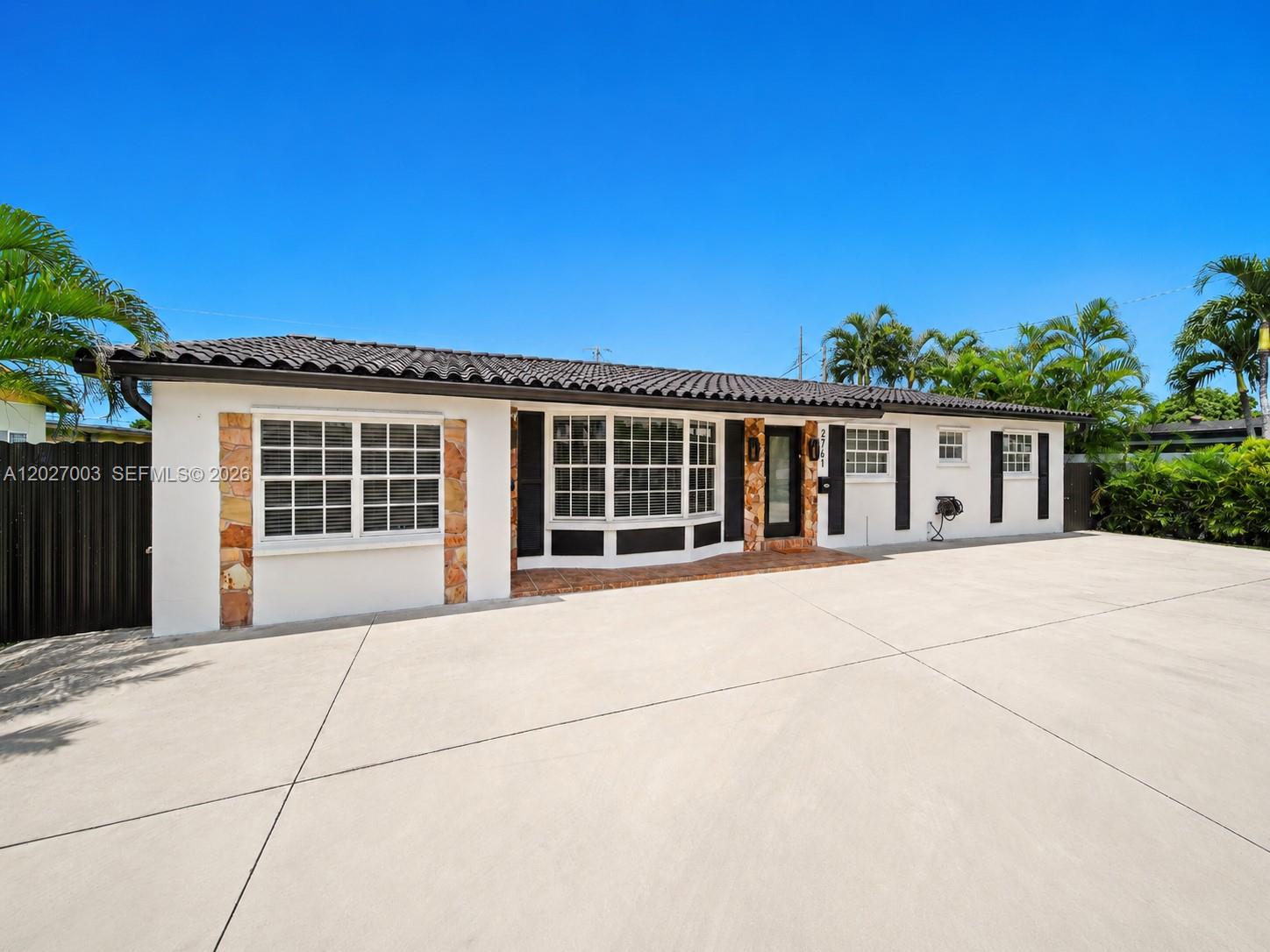 2761 Southwest 92nd Place Miami, FL 33165 - Photo 21 of 37 front view of a house with a outdoor space