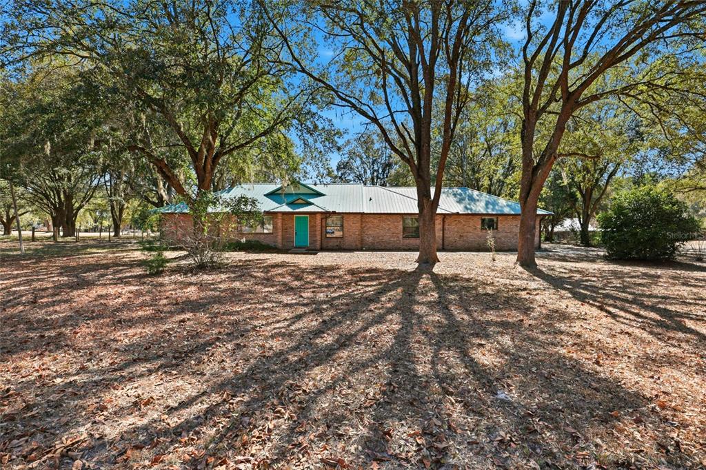 534 Southwest Thorne Lane Fort White, FL 32038 - Photo 2 of 51 a view of outdoor space with deck and tree