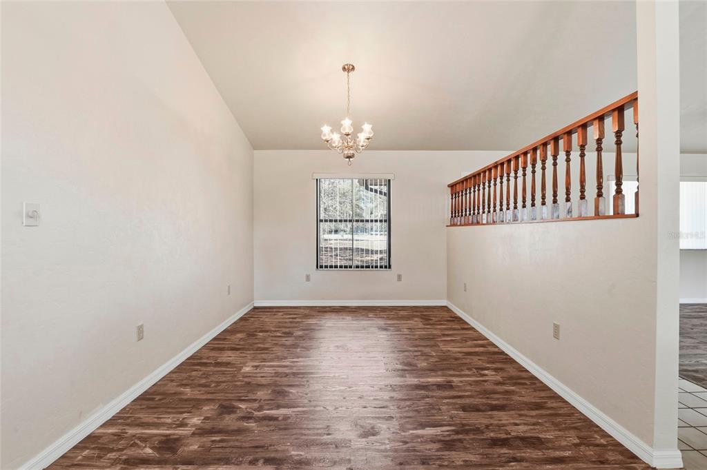 534 Southwest Thorne Lane Fort White, FL 32038 - Photo 24 of 51 wooden floor in an empty room with a window