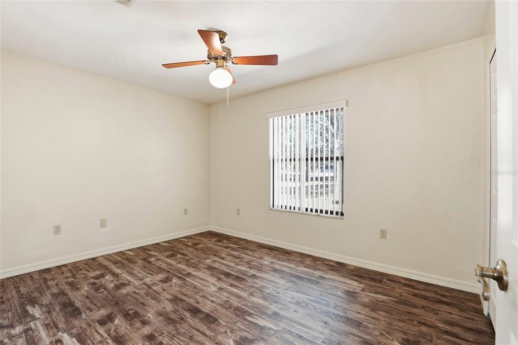 534 Southwest Thorne Lane Fort White, FL 32038 - Photo 26 of 51 wooden floor in an empty room with a window